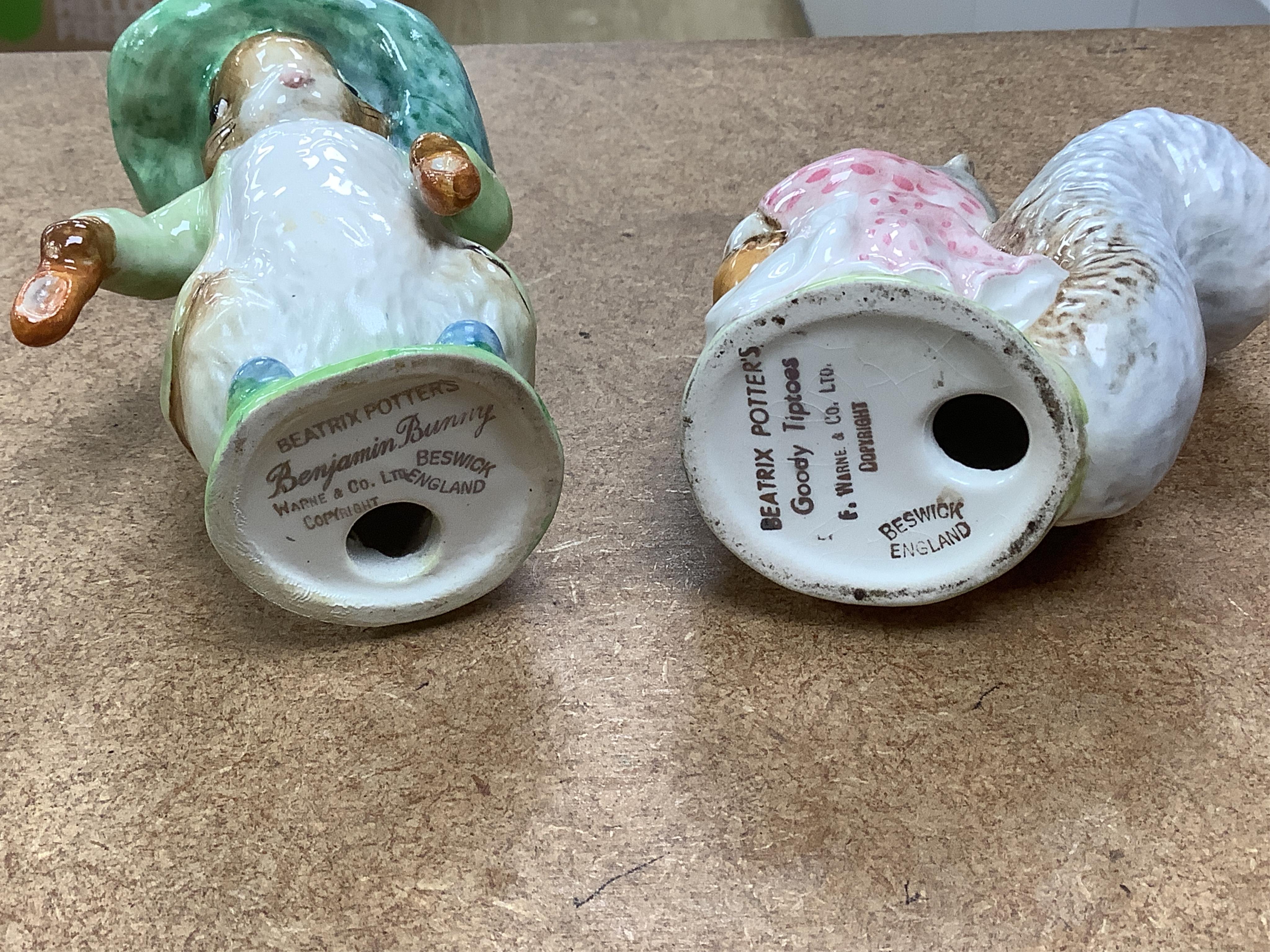 A collection of thirteen Beatrix Potter character figures, stamped with a gold stamp F Warne and Co Ltd, Beswick England, largest 12cm high